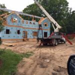 Framing the roof on a house and Torch Lake