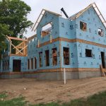 Framing the roof on a house and Torch Lake