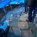 Laying flagstone in winter weather.