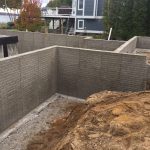Poured walls and poured crawlspace floor and our very popular 6’8” high crawlspace about every house we build now has a full basement or a 6‘8“ crawlspace with stairs leading to the area not a ladder not a hatch but a proper door with stairs and the ability to walk instead of crawl great storage area too!