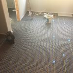 Installing heated floor in master bath.