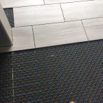 Installing heated floor in master bath.